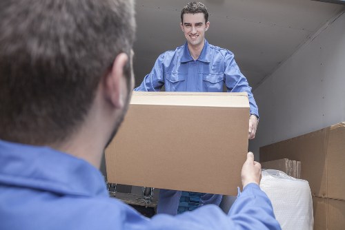 Office removals planning in Greenford with desks and packing boxes