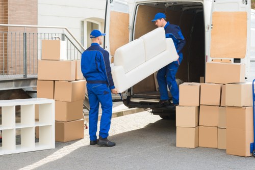 Furniture pick-up team loading a sofa in Greenford