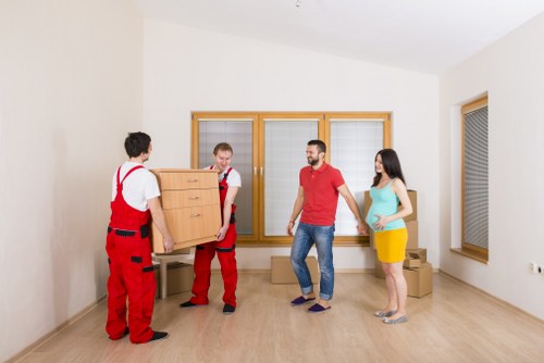 Local movers loading boxes and furniture near Greenford homes
