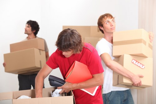 Team member checking stacked belongings before transport