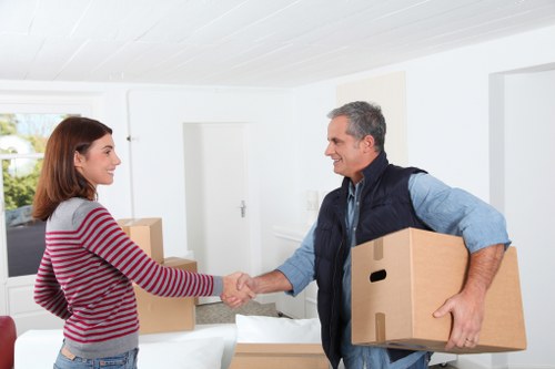 Professional movers handling household belongings in Greenford