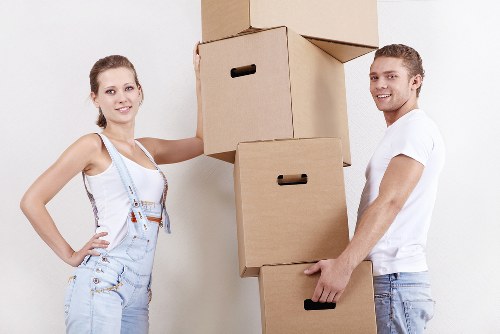 Local moving truck loading furniture and boxes in Greenford